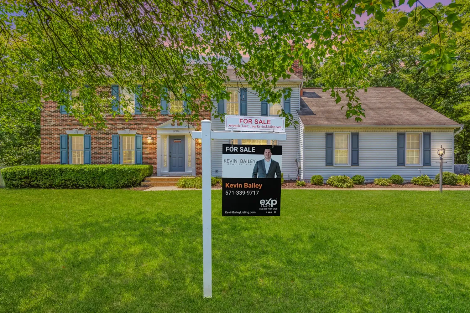 A home with Kevin Bailey’s for-sale sign in the yard.